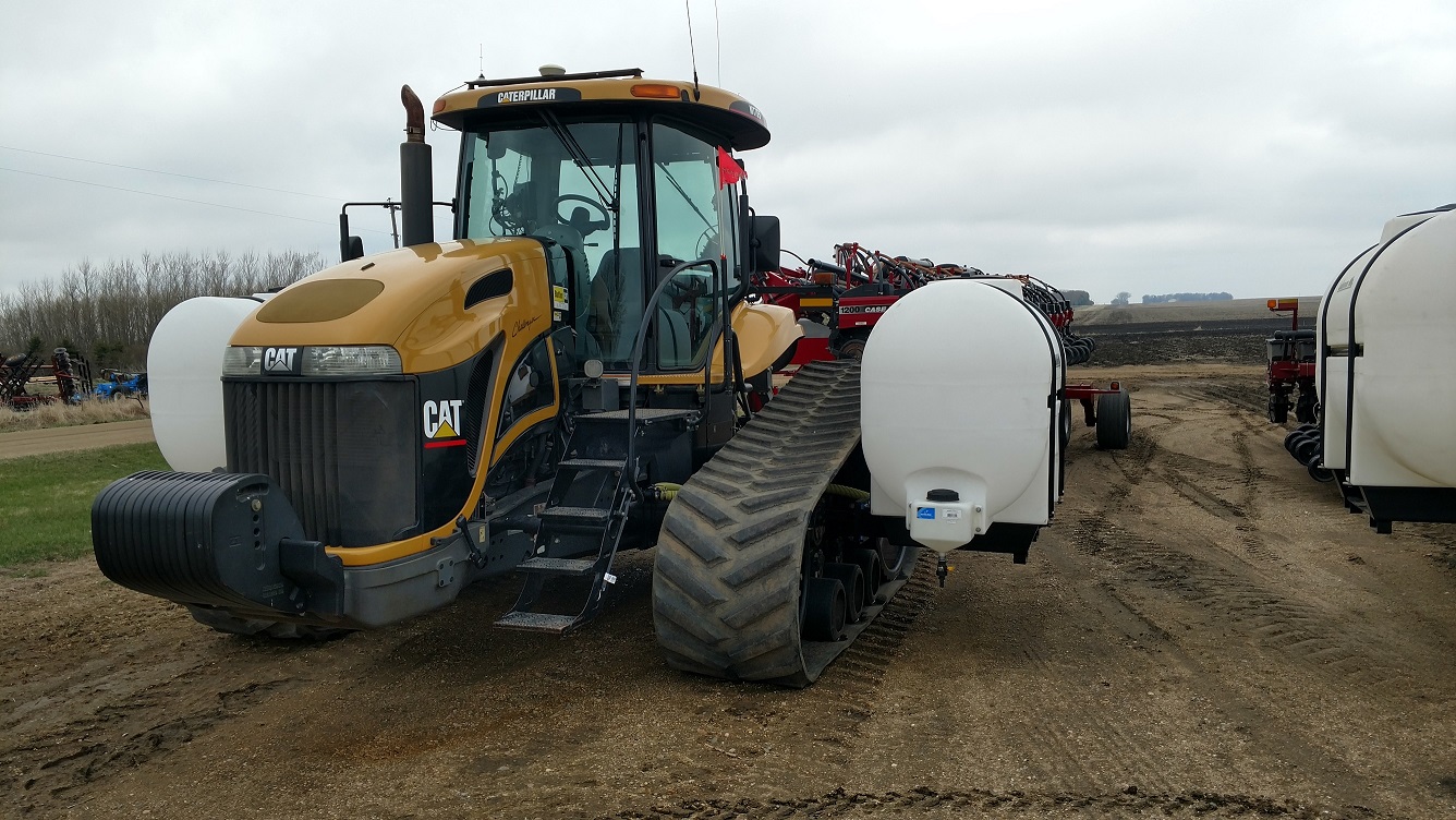 Lakestate Mfg tractor tank mounts on a Cat Challenger