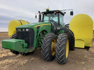 John Deere tractor with tracs and new 600 gallon side tanks